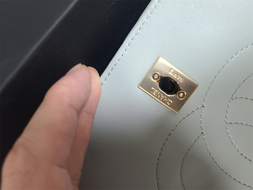 Ch*el flap bag with top handle 6.6 × 9.8 × 4.7 in